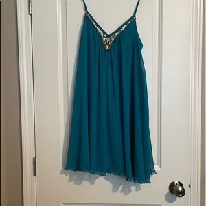 Spaghetti strap mini dress with sequin neckline. Deep teal color. Like new.
